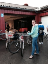 Here I am with the three bikes we bought at the auction. Ruth is crouching on the left, working on her newly purchased bike.
