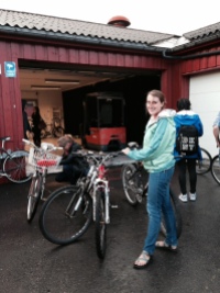 Here I am with the three bikes we bought at the auction. Ruth is crouching on the left, working on her newly purchased bike.